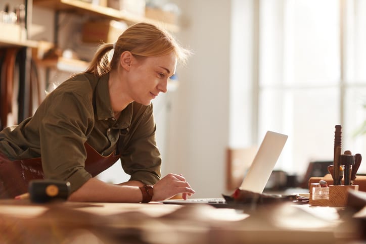 woman looking at her laptop