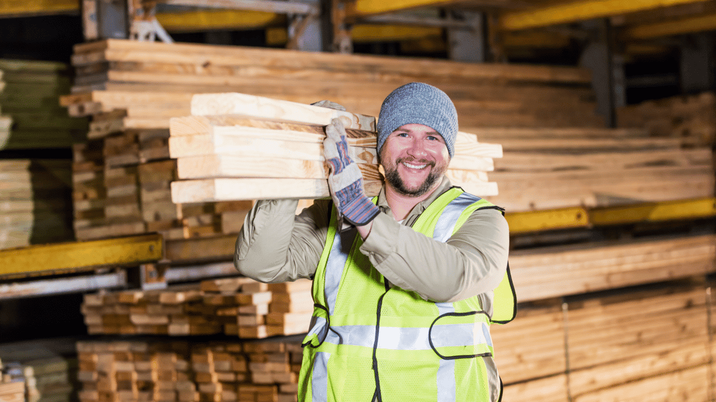 man holding timber
